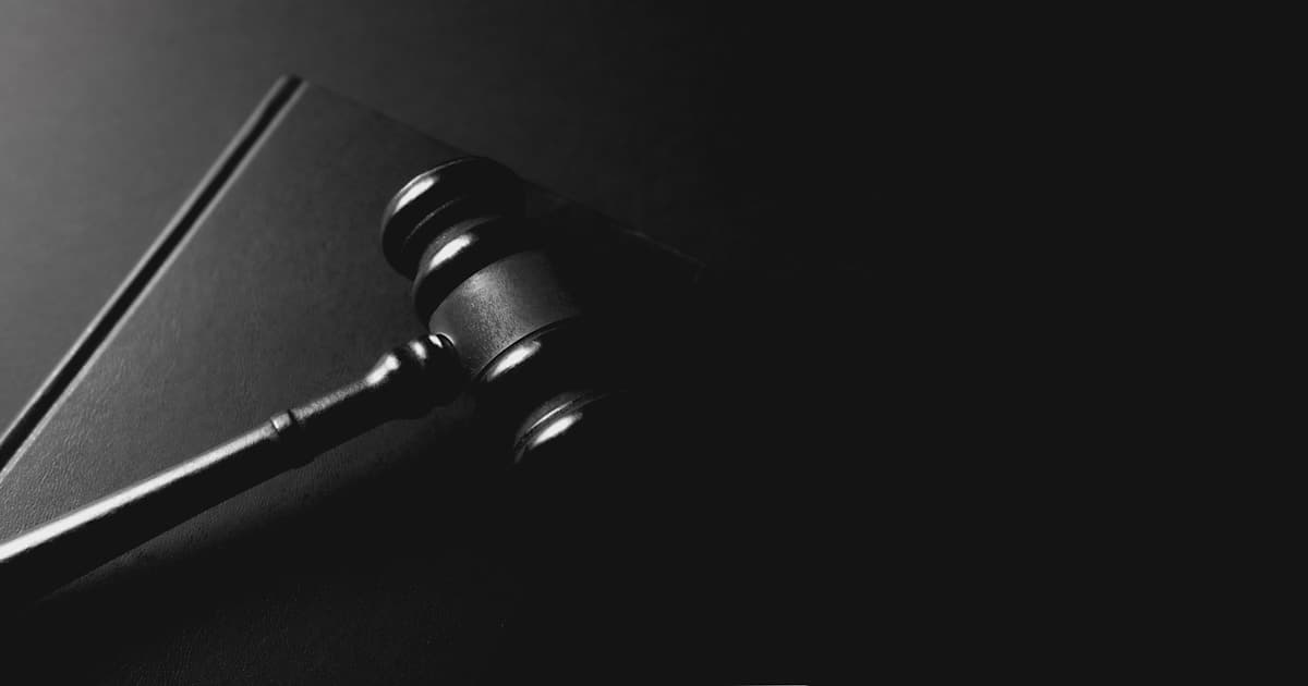 A judge's gavel on a dark table representing the OpenAI and Elon Musk lawsuit