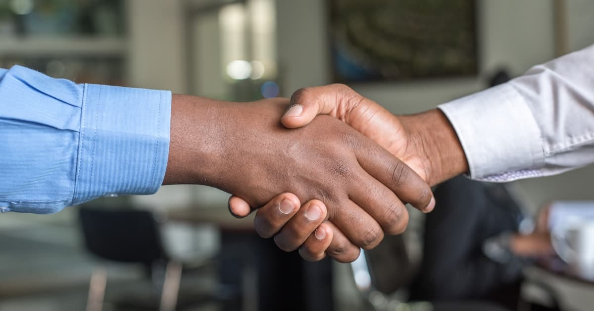 Digital handshake illustration symbolising HR integration